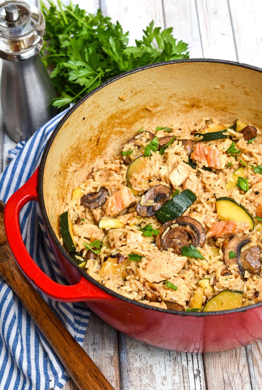 CHICKEN ZUCCHINI RICE SKILLET IN A LARGE RED DUTCH OVEN
