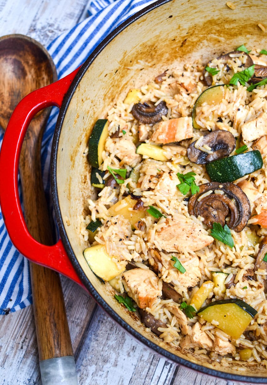 CHICKEN ZUCCHINI RICE SKILLET IN A LARGE RED DUTCH OVEN