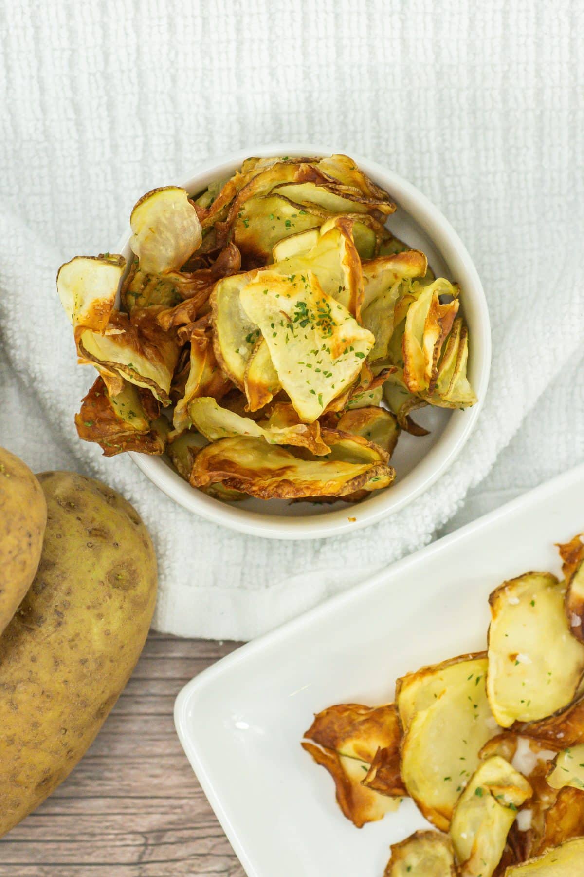 homemade potato chips in a small white bowl