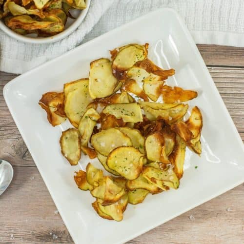 homemade potato chips on a small white plate