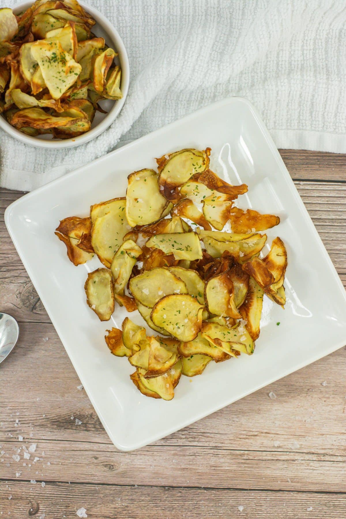 homemade potato chips on a small white plate
