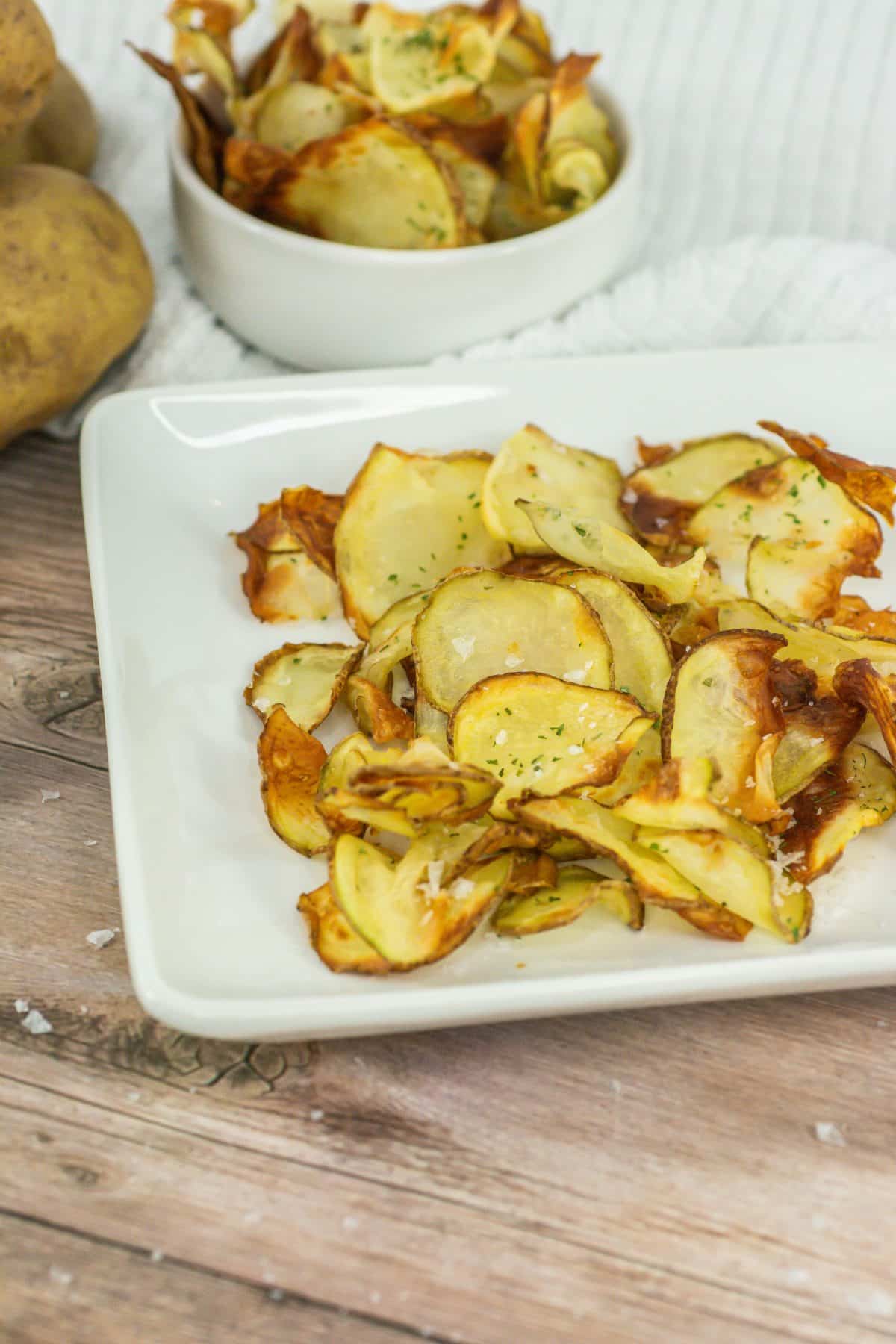 homemade potato chips on a small white plate