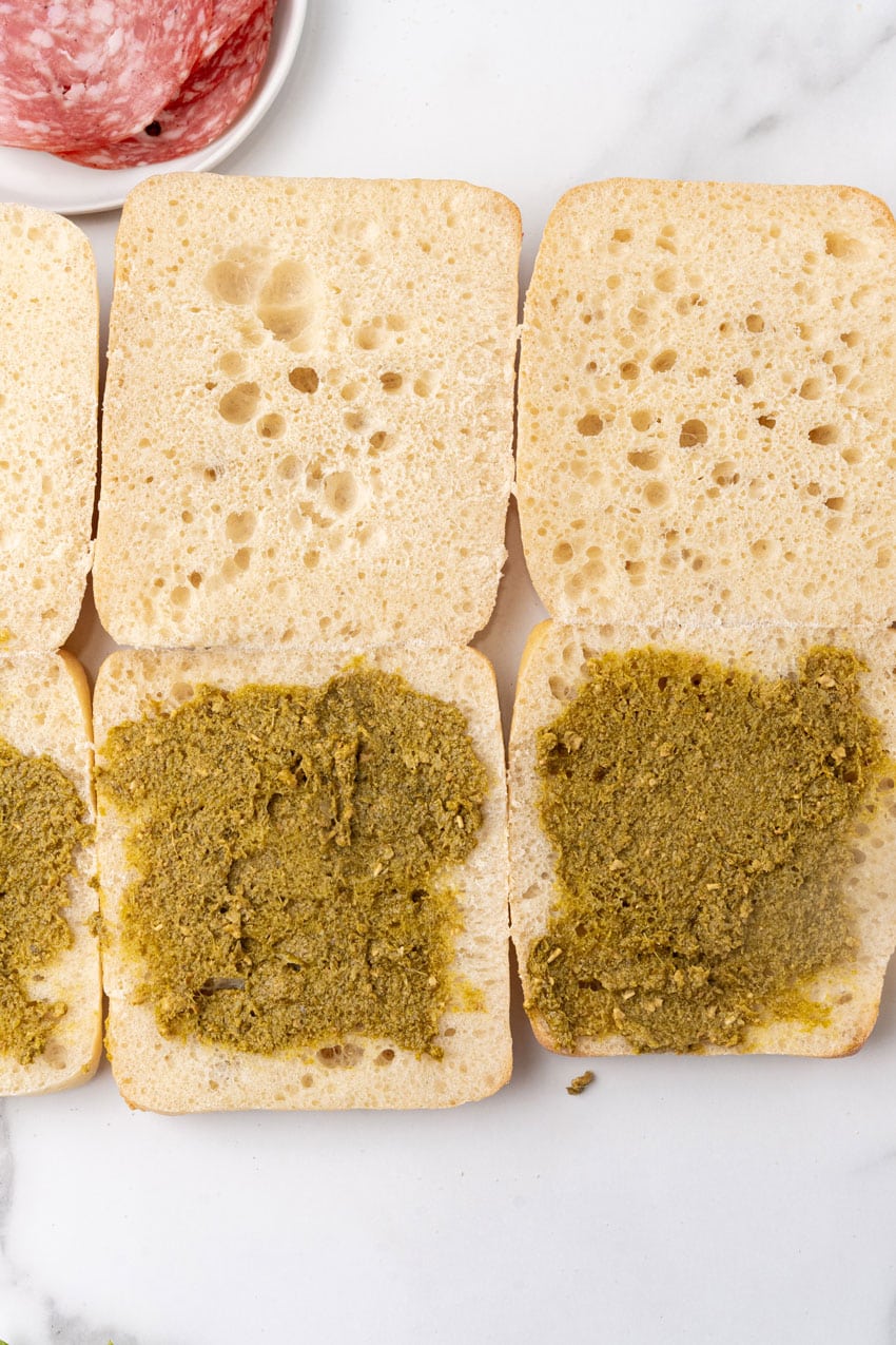 halved ciabatta rolls spread with basil pesto