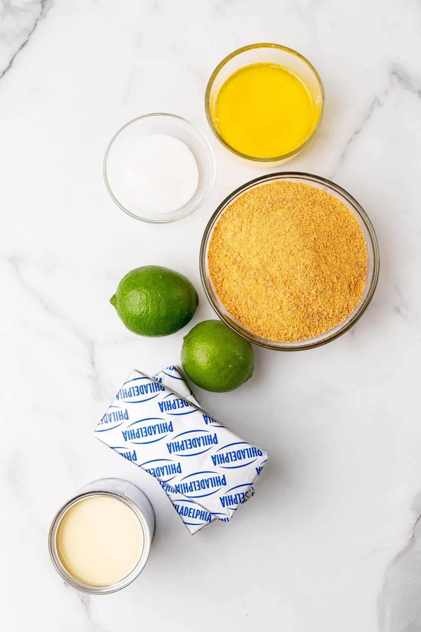 an overhead image showing the measured ingredients needed to make a no bake key lime pie cheesecake