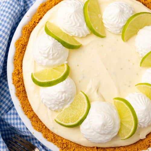 a no bake key lime pie cheesecake in a white pie dish