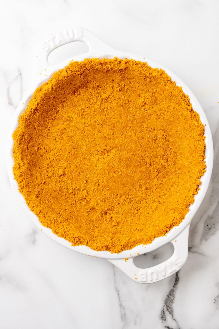 a graham cracker crumb crust pressed into a white pie plate