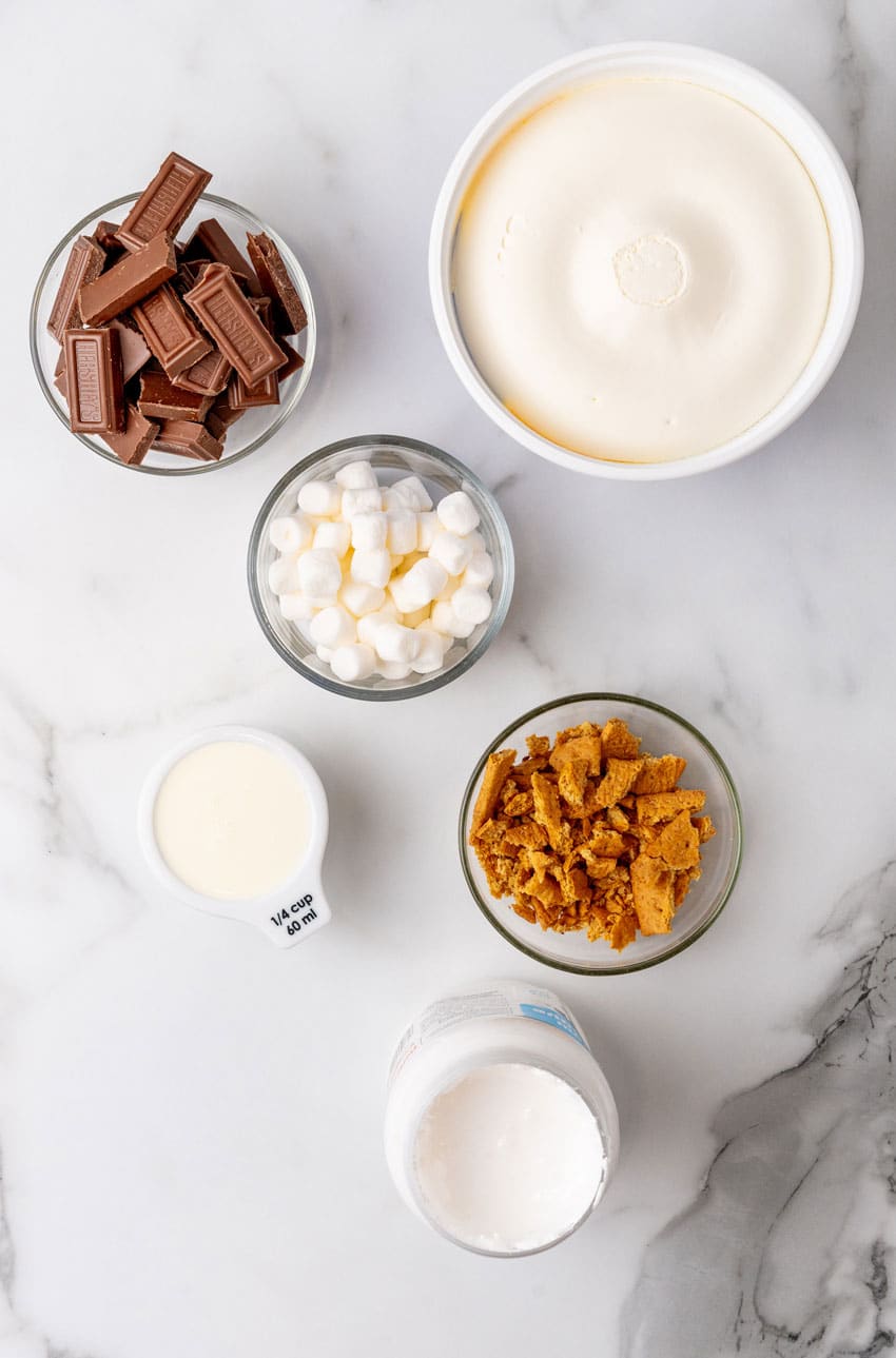 an overhead image showing the measured ingredients needed to make a batch of frozen s'mores ice cream pops
