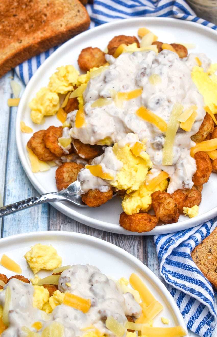 a silver fork digging into an easy breakfast bowl on a white plate