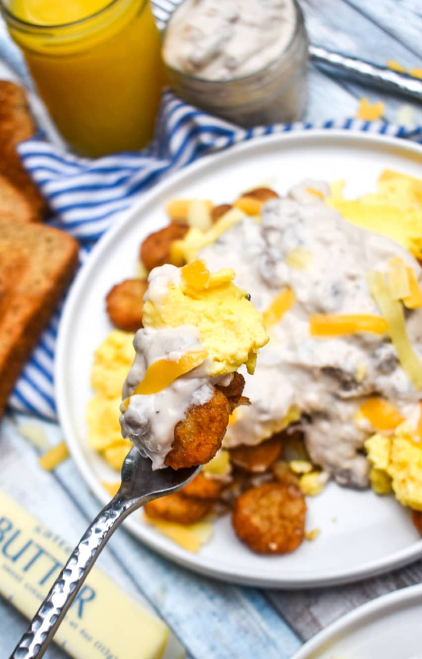 a silver fork holding up a scoop of an easy breakfast bowl
