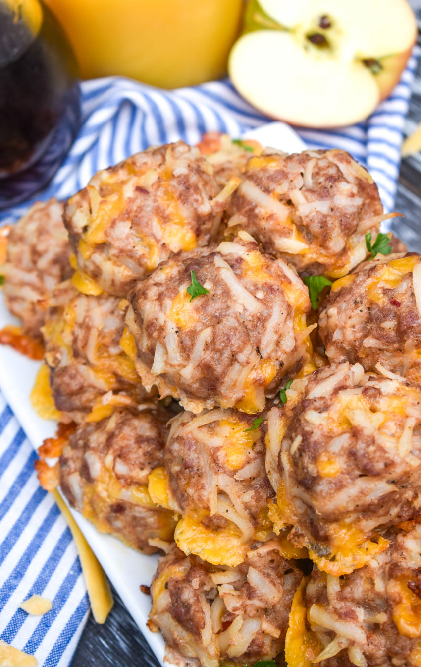 a pile of breakfast sausage balls on a white serving platter
