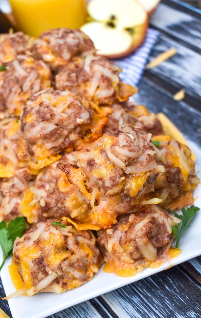 a pile of breakfast sausage balls on a white serving platter