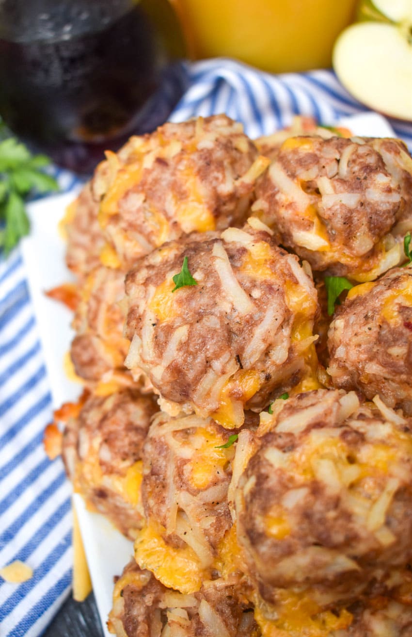 a pile of breakfast sausage balls on a white serving platter