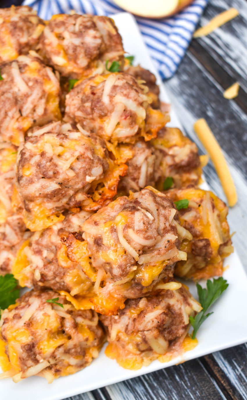 a pile of breakfast sausage balls on a white serving platter