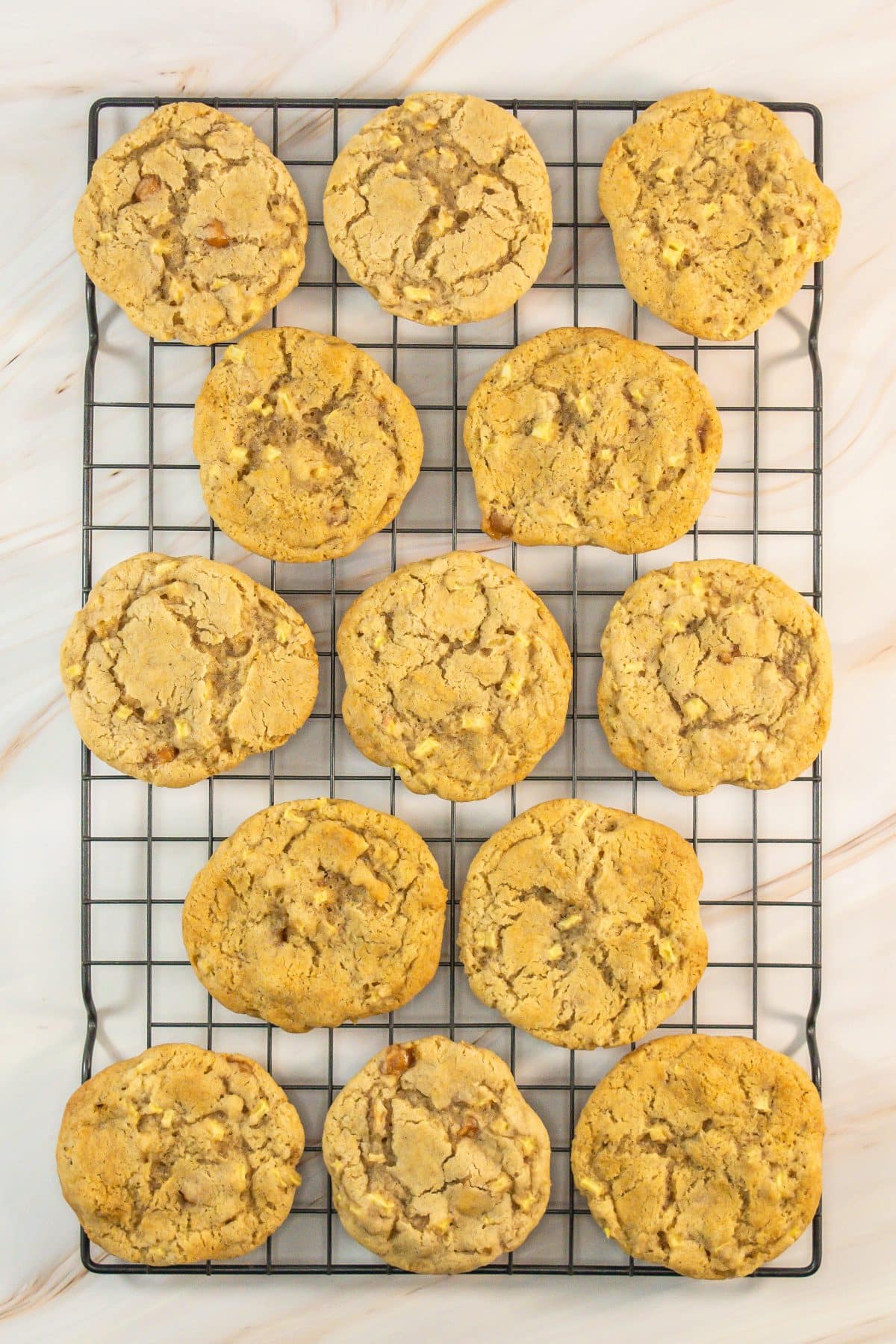 caramel apple cookies cooling on a wire rack
