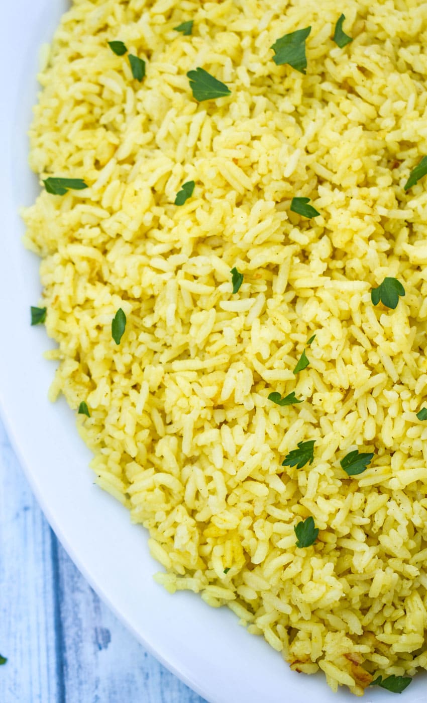 instant pot yellow rice in a white serving dish