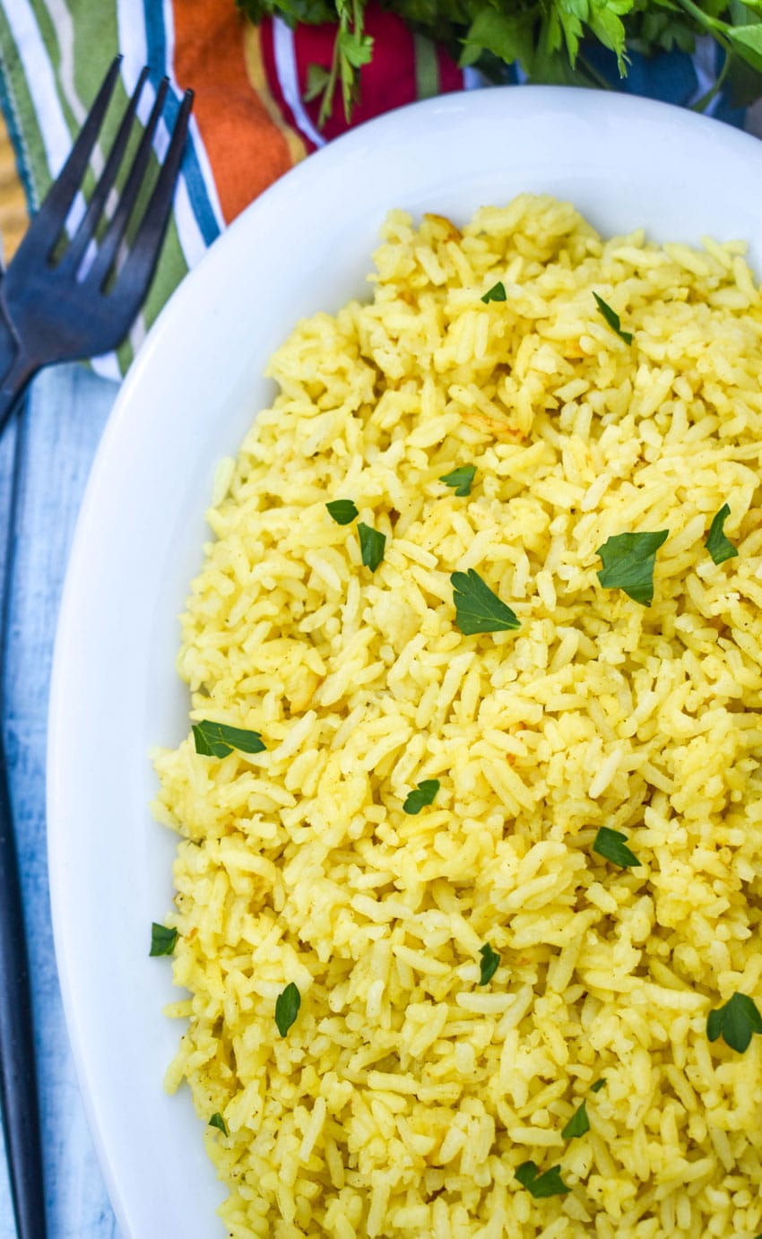 instant pot yellow rice in a white serving dish