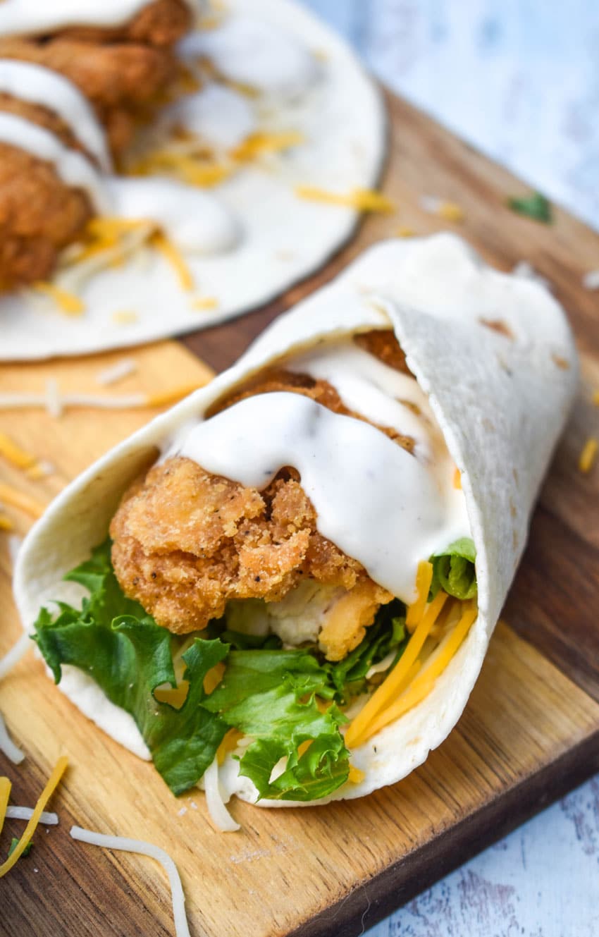mcdonald's copycat chicken snack wraps resting on a wooden cutting board