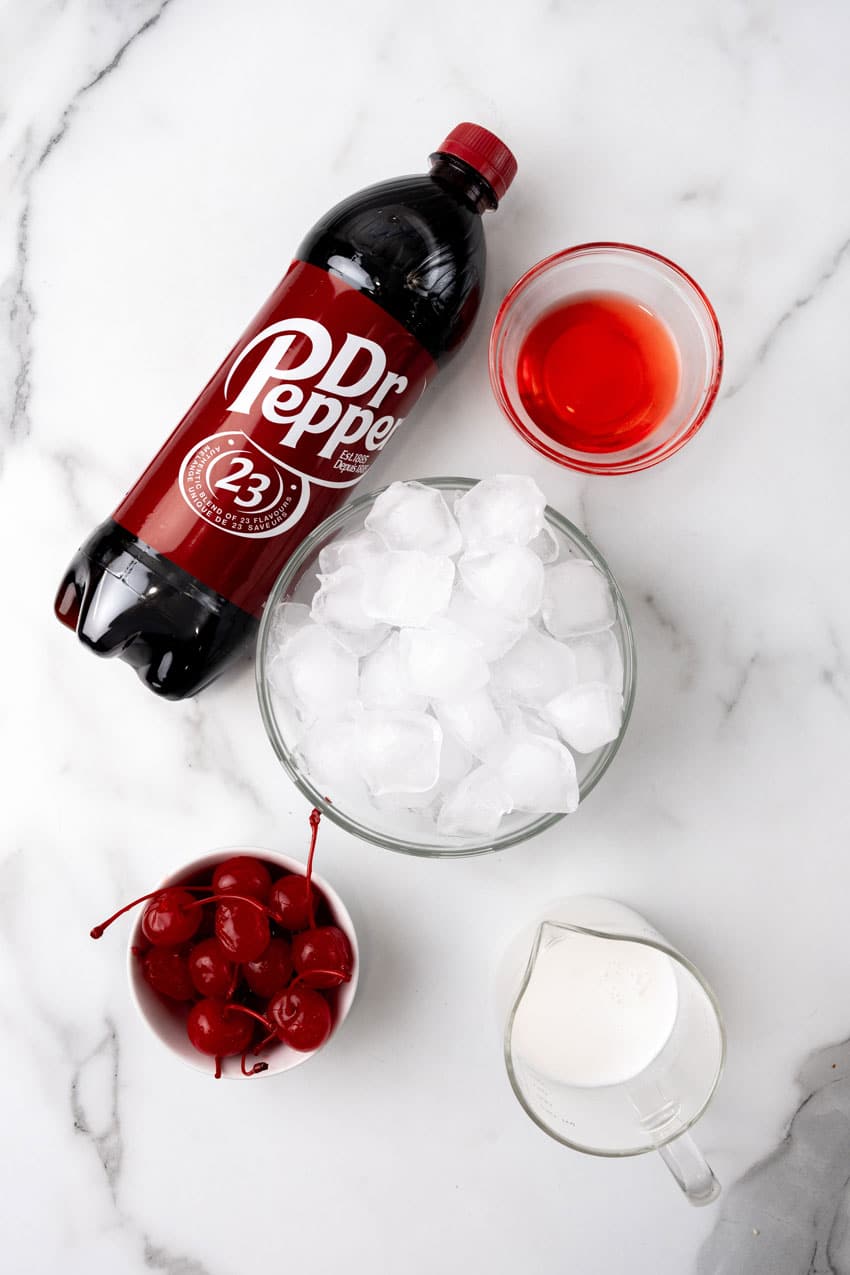 an overhead image showing the measured ingredients needed to make a dirty soda