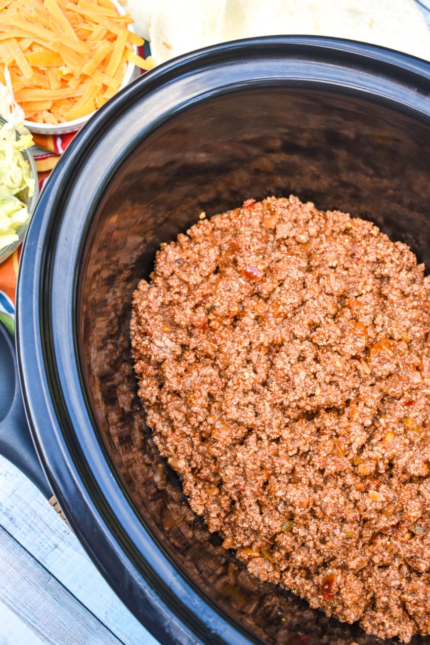 slow cooker taco meat in a large black crock