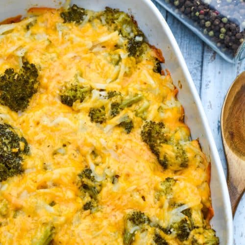 cheesy broccoli potato casserole in a white baking dish