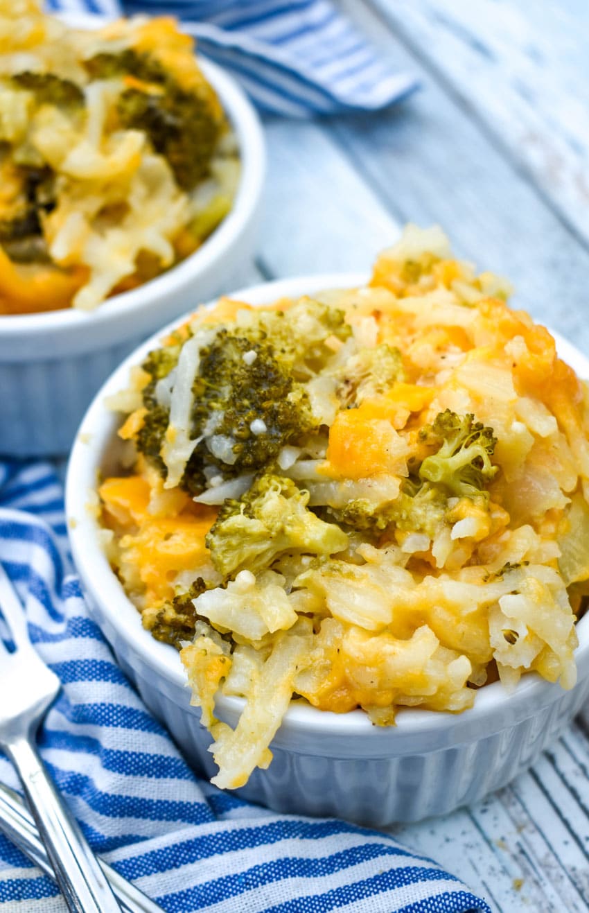 cheesy broccoli potato casserole in two small white ramekins