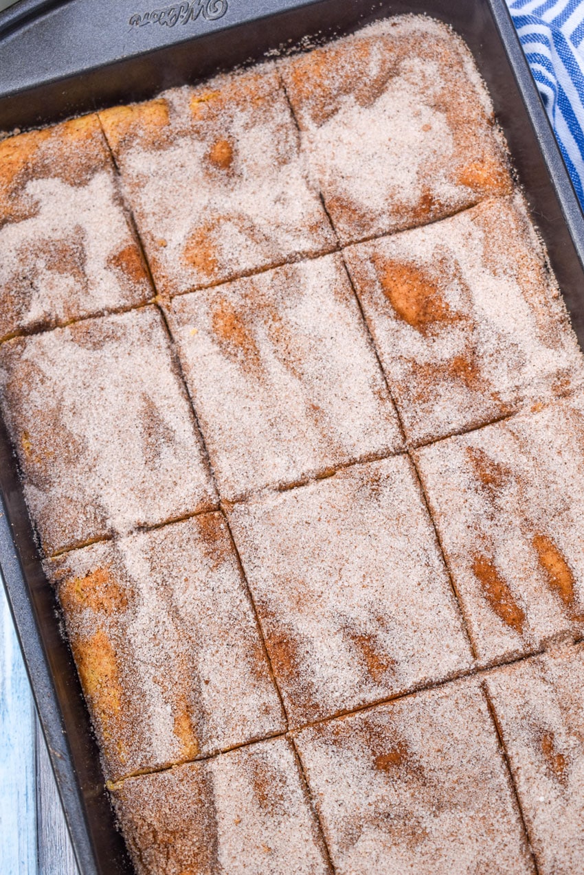 cake mix churro bars in a metal brownie pan