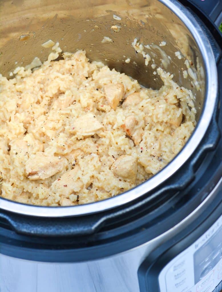 creamy chicken and rice in the bowl of an instant pot pressure cooker