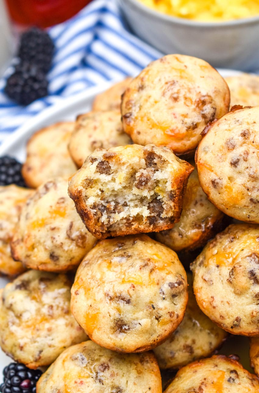 a stack of mcgriddle bites on a white plate with fresh blackberries on the side