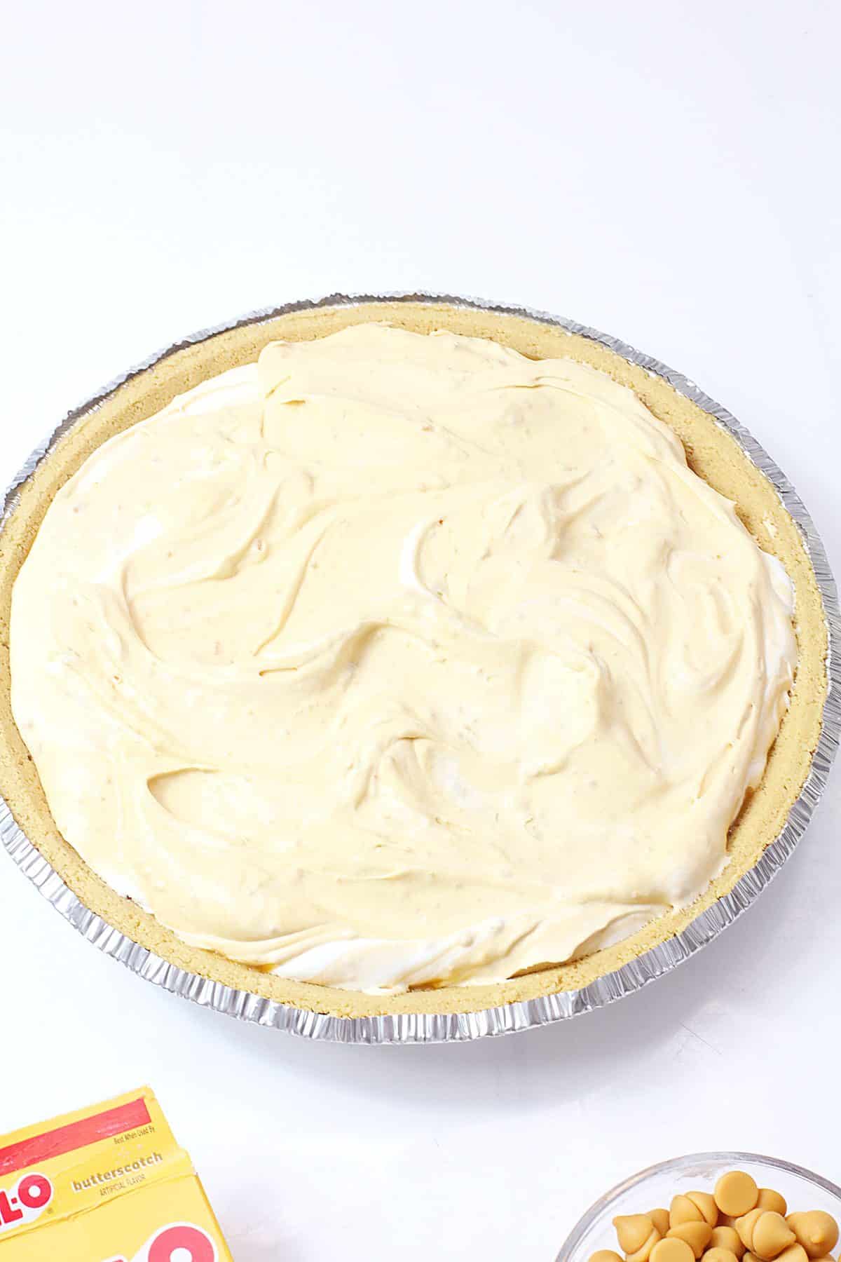 butterbeer pie filling in a premade pie crust