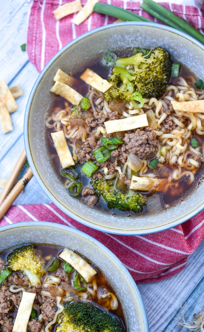 ground beef and broccoli ramen soup in two small gray bowls