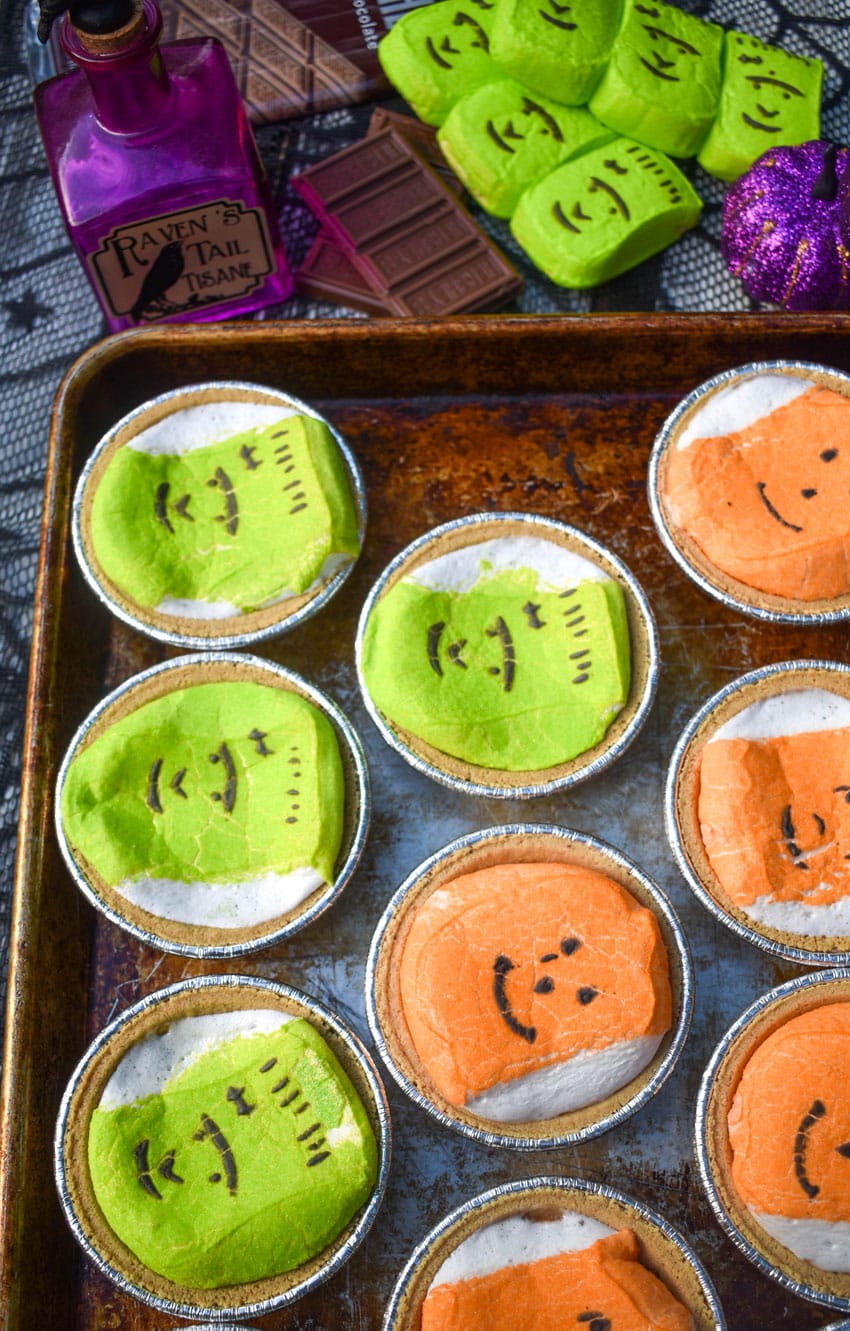 halloween peeps mini s'mores pies on a metal baking sheet