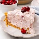 a slice of cranberry fluff pie on a small white dessert plate