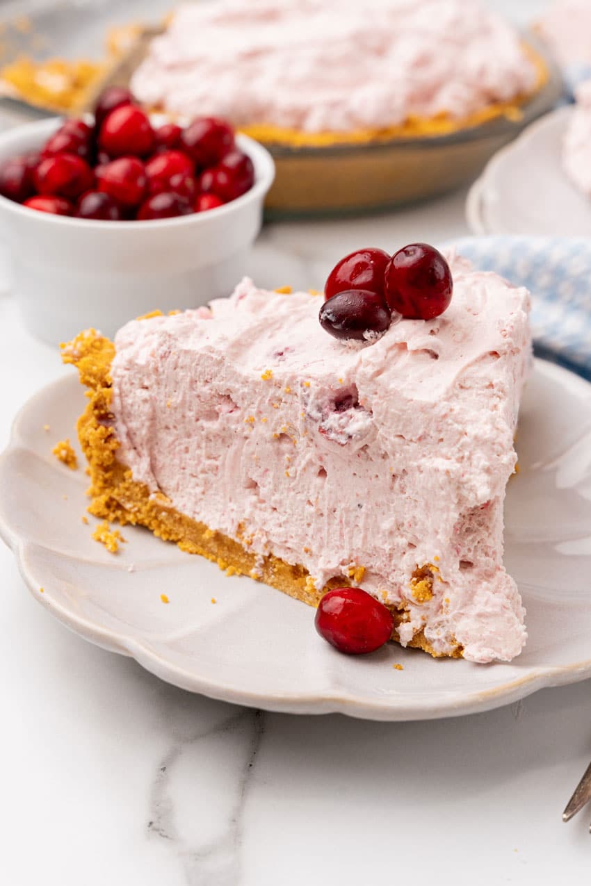 a slice of cranberry fluff pie on a small white dessert plate