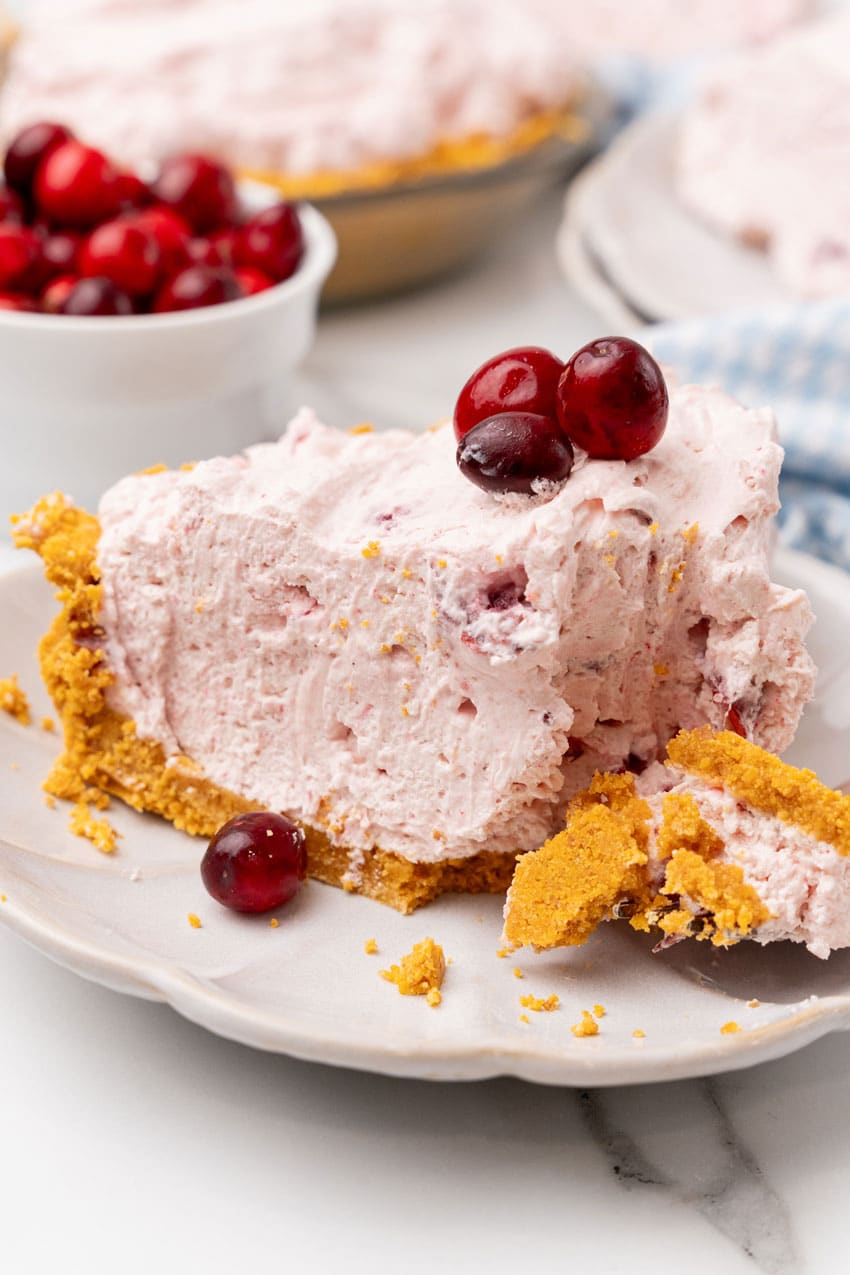 a slice of cranberry fluff pie on a small white dessert plate