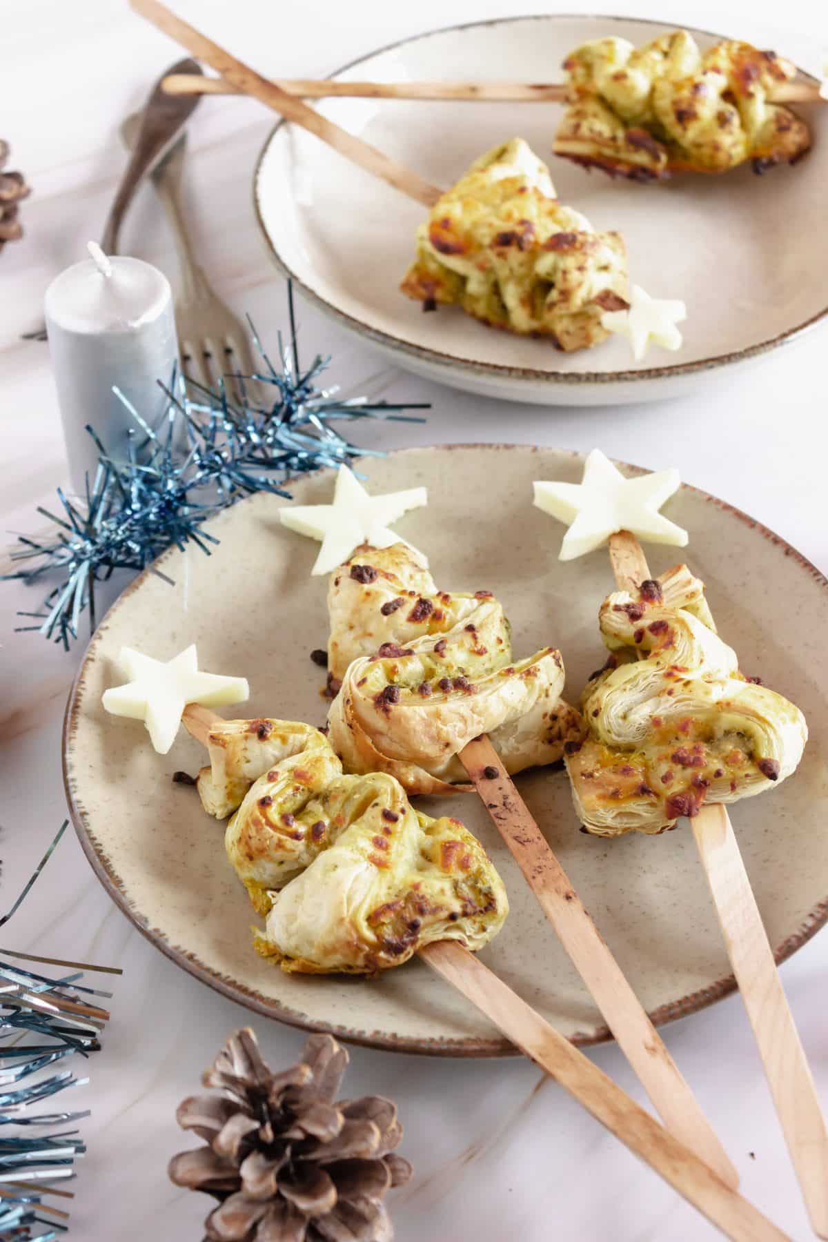 Pesto Puff Pastry Christmas Trees pesto puff pastry christmas trees on a white plate