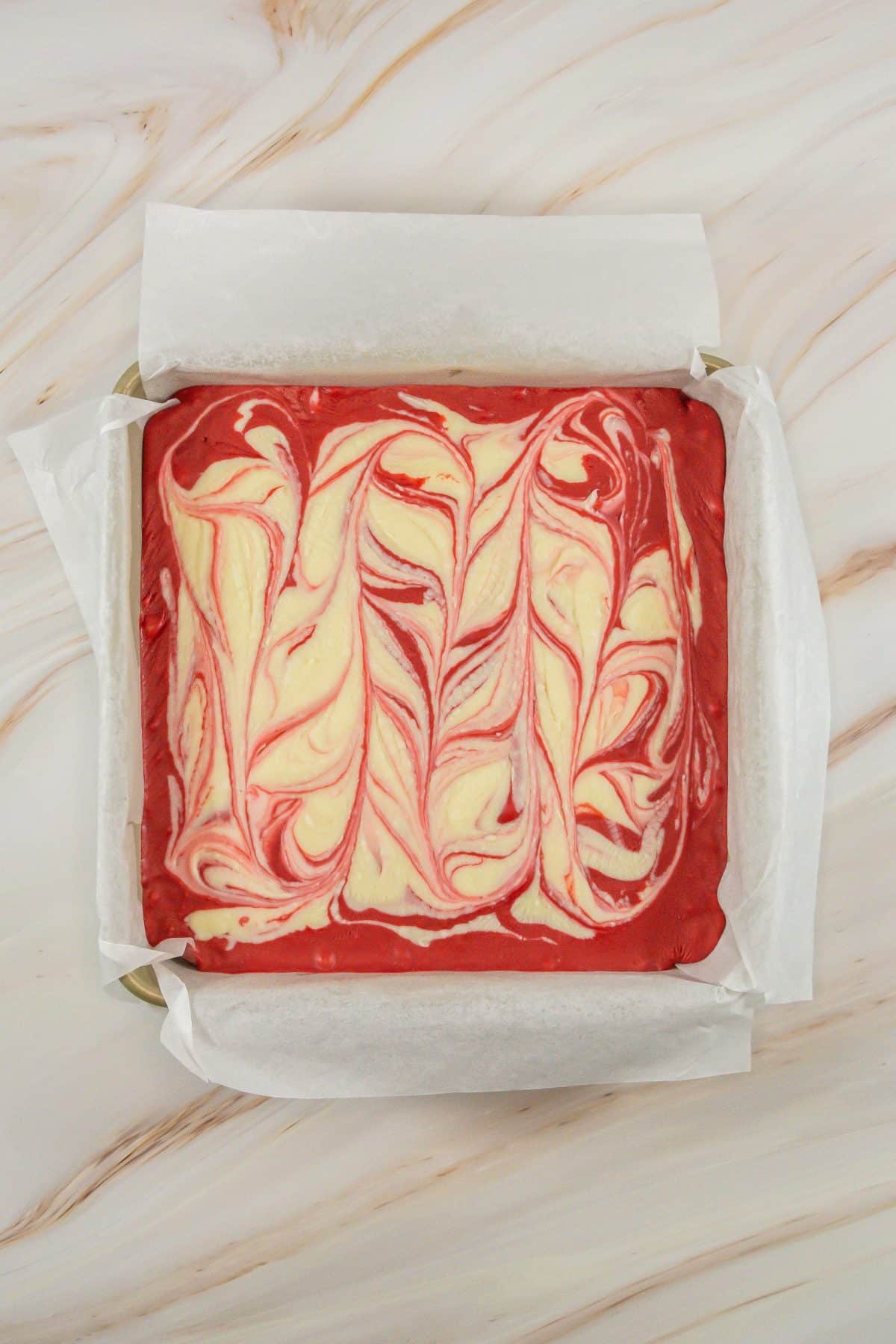 set red velvet fudge in a parchment paper lined baking dish