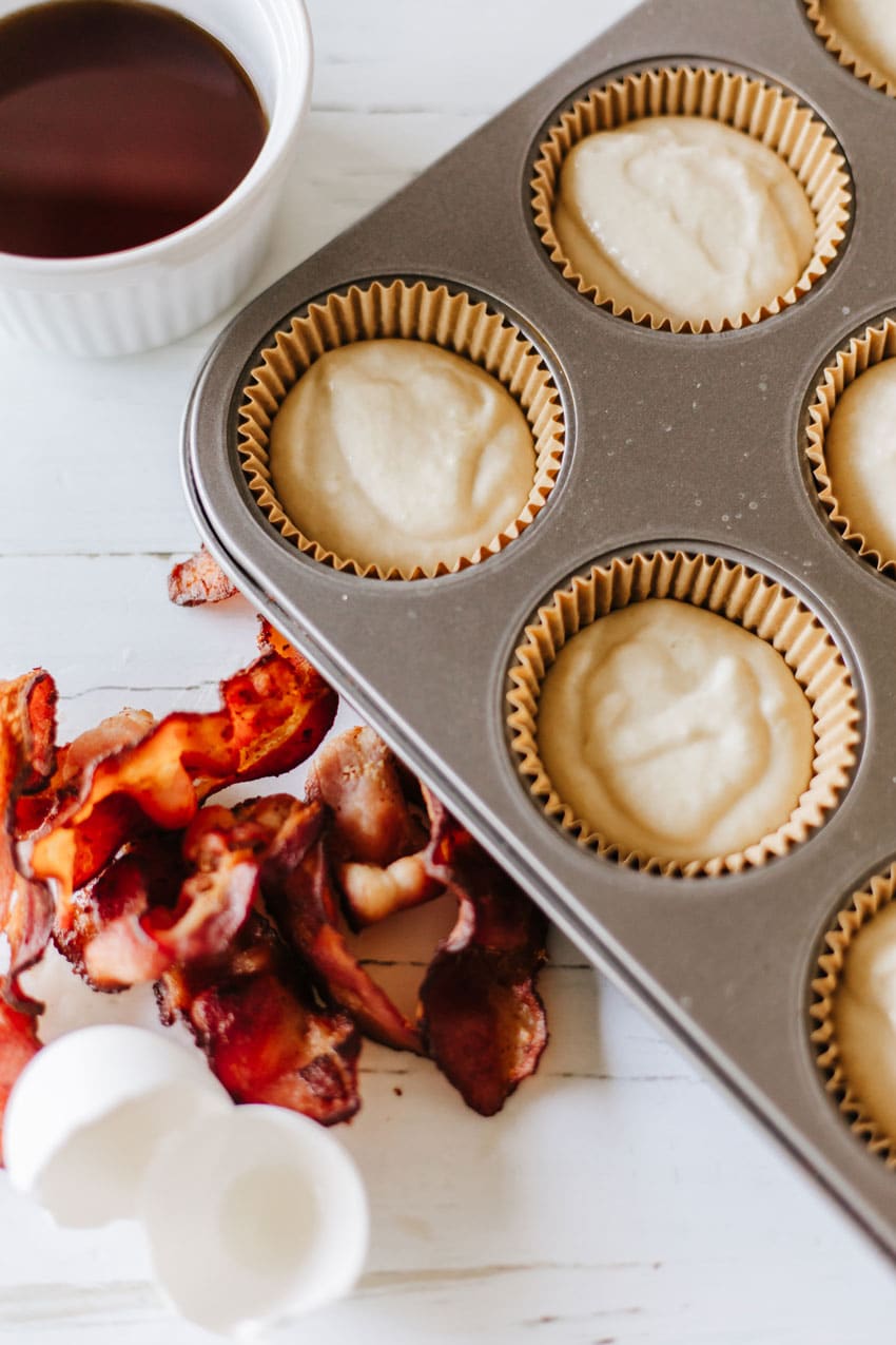 pancake muffin batter in paper cups in a metal cupcake pan