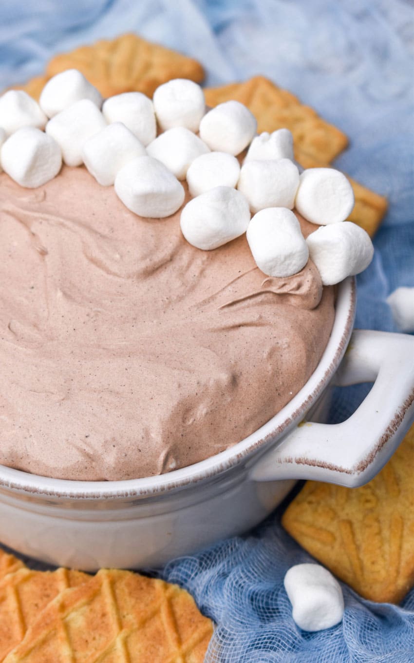 Hot Cocoa Dip a white bowl filled with hot cocoa dip topped with mini marshmallows