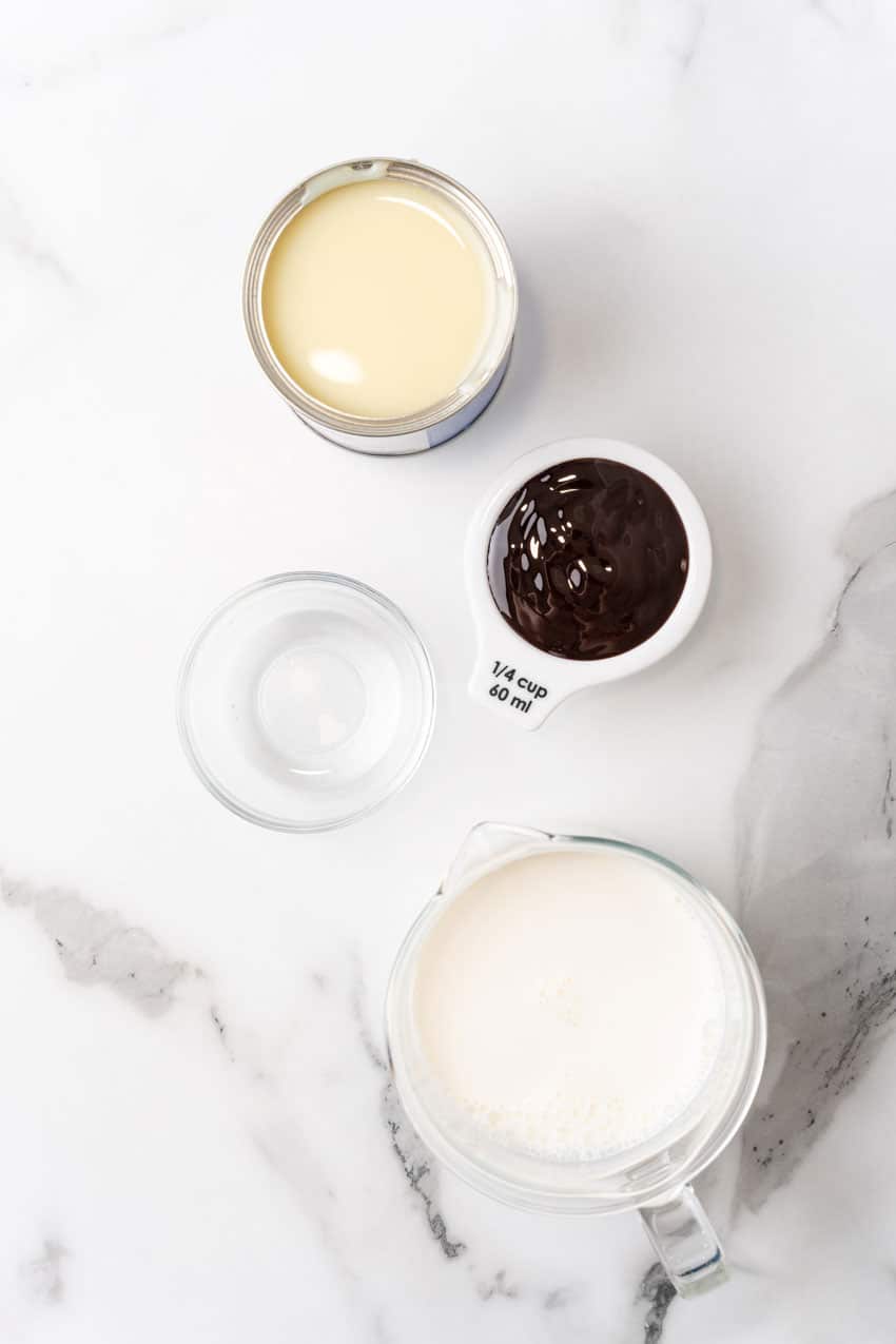 an overhead image showing the measured ingredients needed to make a batch of homemade peppermint coffee creamer