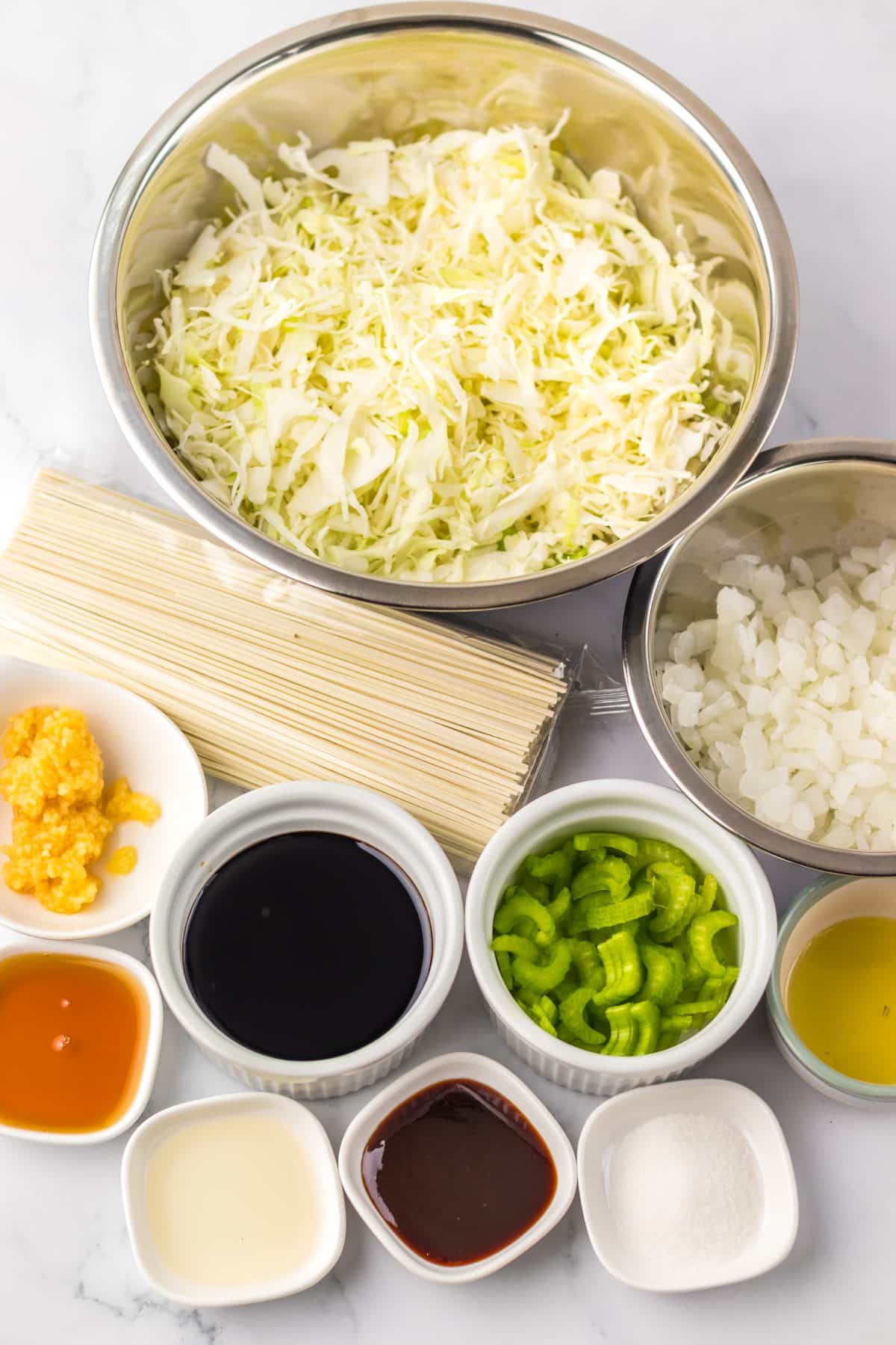 an overhead image showing the measured ingredients needed to make a batch of homemade chinese chow mein