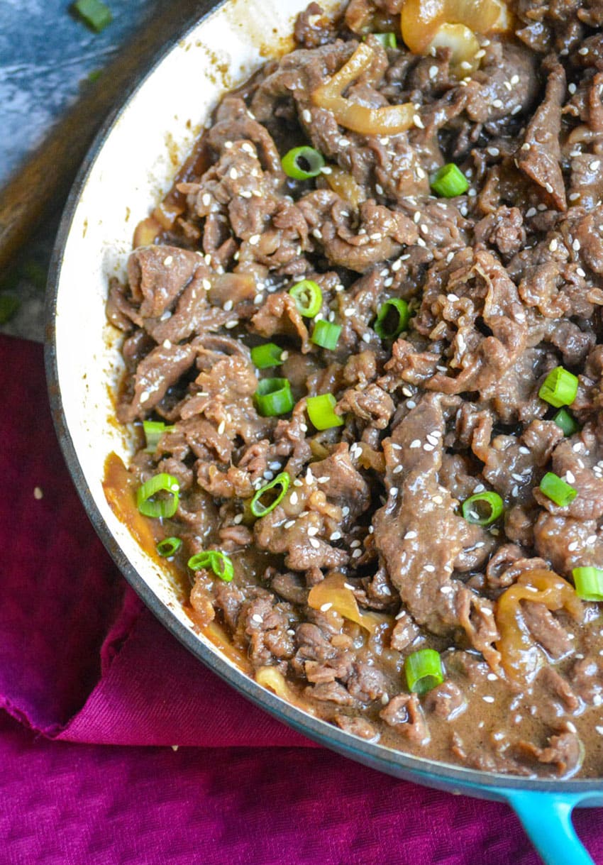 easy beef bulgogi recipe in a shallow blue cast iron skillet