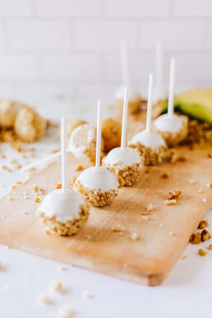banana bread cake pops on a wooden cutting board
