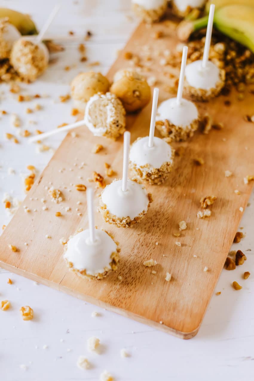 banana bread cake pops on a wooden cutting board