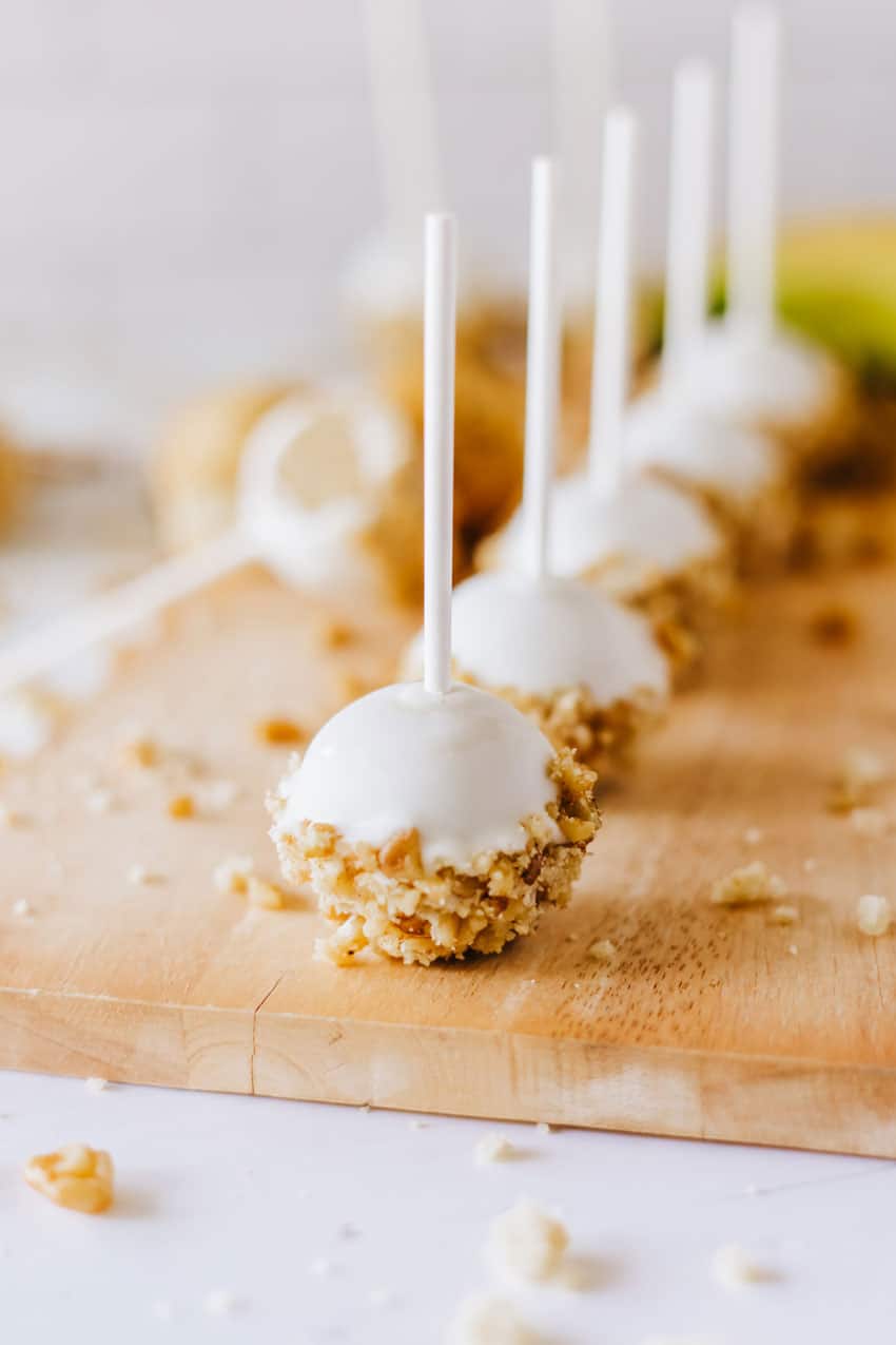 banana bread cake pops on a wooden cutting board