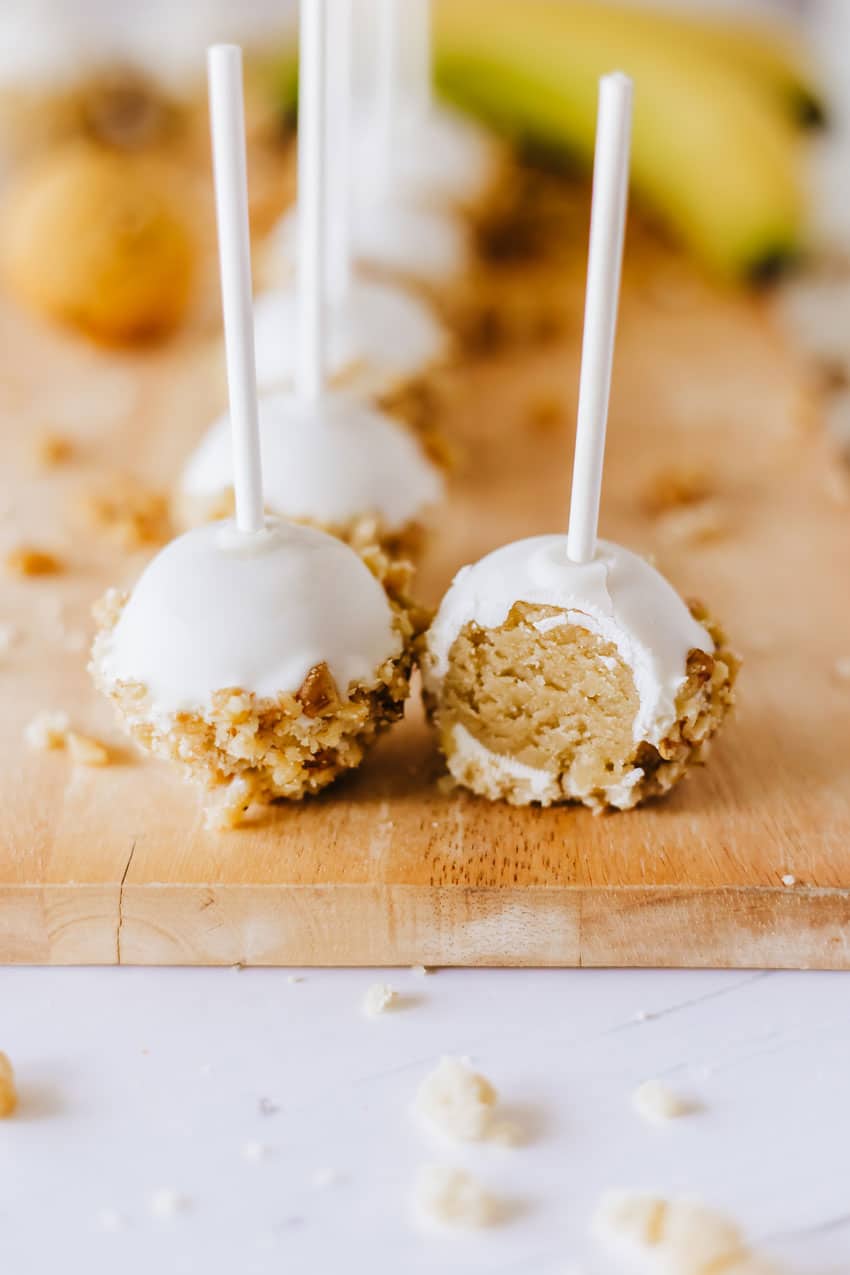 banana bread cake pops on a wooden cutting board