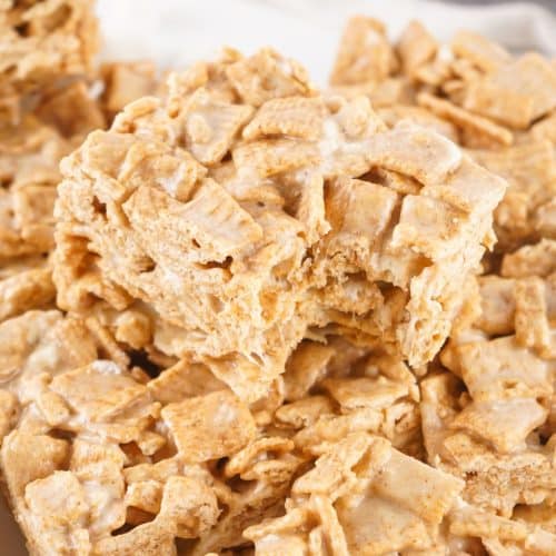 a pile of cinnamon toast crunch treats on a white kitchen counter