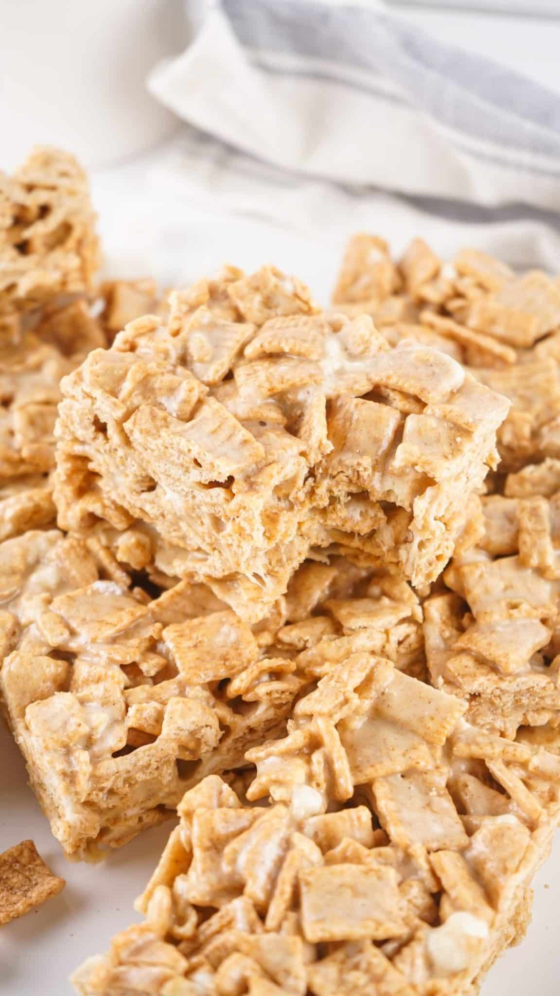 a pile of cinnamon toast crunch treats on a white kitchen counter
