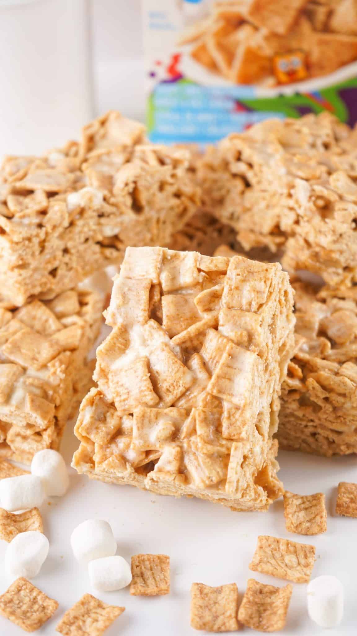 a pile of cinnamon toast crunch treats on a white kitchen counter