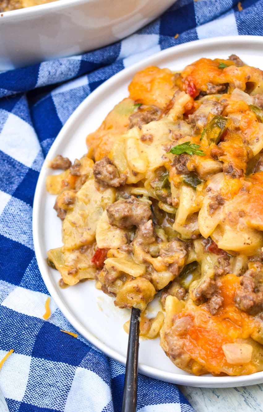 hobo casserole on a white plate with a black fork resting on the side