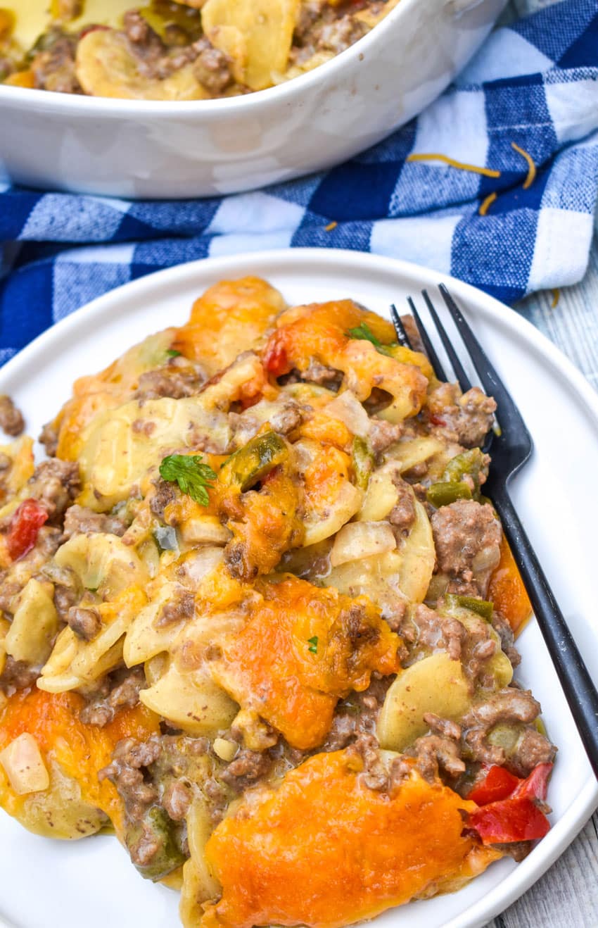 hobo casserole on a white plate with a black fork resting on the side